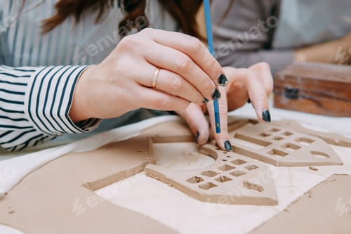 Preview: Women's hands knead clay, drawing elements of the product. Production of ceramic products