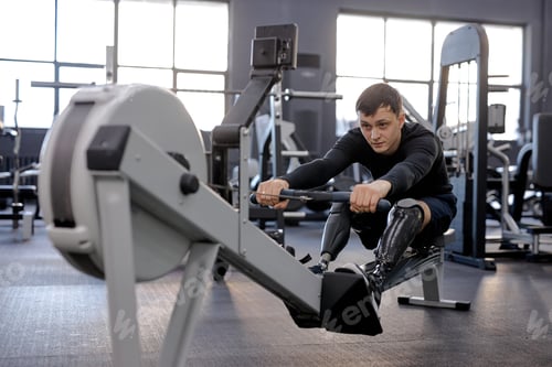 Preview: hardworking young man in stylish sportswear performs cardio workout