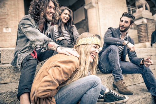 Preview: Group of four friends laughing out loud outdoor, sharing good and positive mood