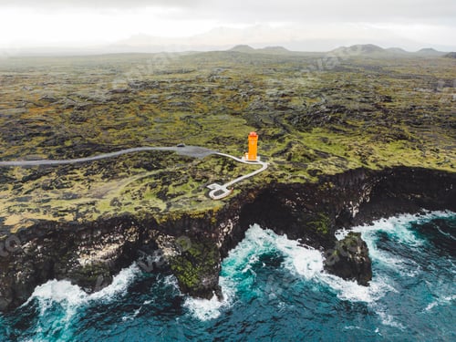Preview: Aerial view of orange Svortuloft Lighthouse by the sea in West Iceland highlands, Snaefellsnes