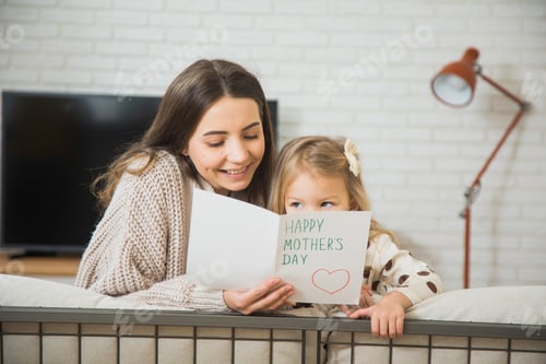 Preview: Happy Mother's Day, little daughter giving gift box to mother.