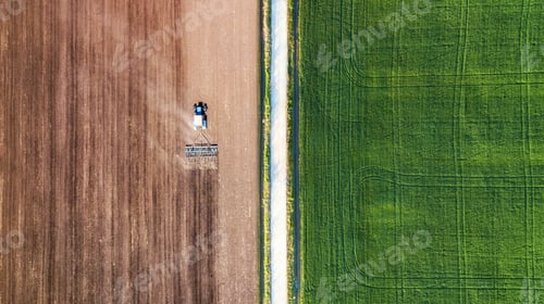 Preview: The tractor's in the field. Agricultural landscape from the air.