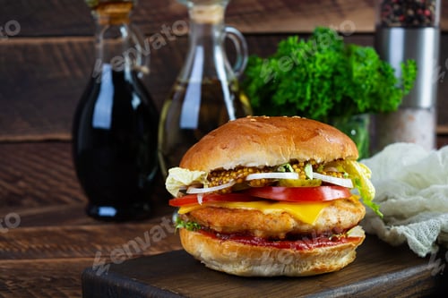 Preview: Tasty chicken burger with lettuce, cheese, tomato and pickle. Fast food sandwich with chicken cutlet