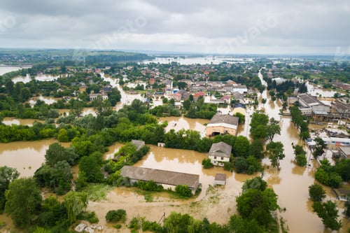 Preview: Aerial view of flooded houses with dirty water of Dnister river in Halych town, western Ukraine
