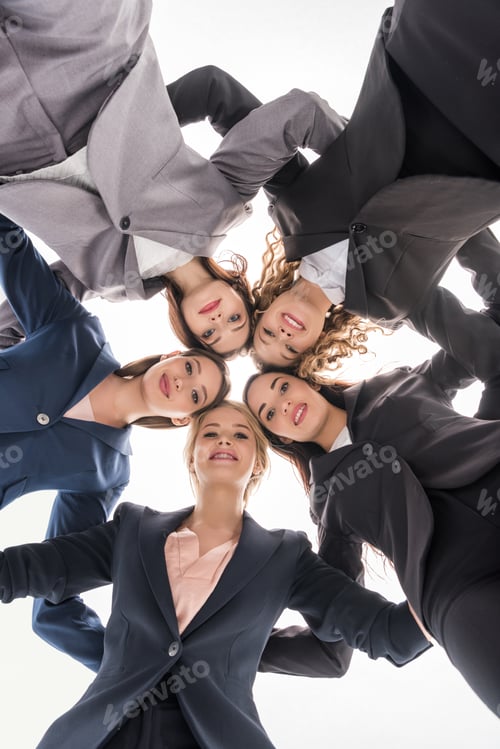 Preview: bottom view of cheerful businesswomen hugging isolated on grey