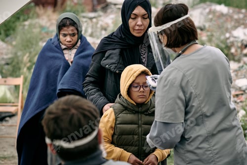 Preview: Checking Temperature Of Refugee Child