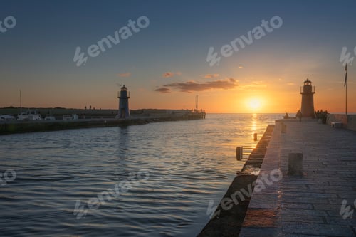 Preview: Castiglione della Pescaia, red and blue lighthouses at sunset. Maremma Tuscany, Italy