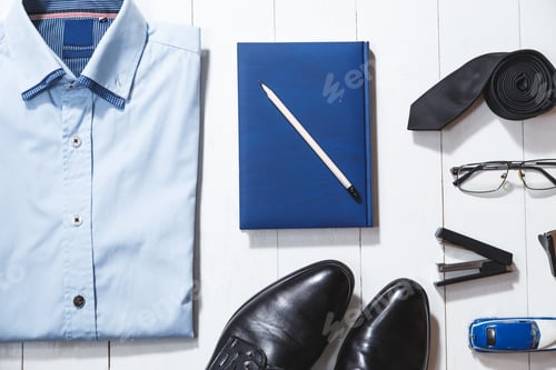 Preview: Flat lay fashion set of businessman accessories, top view on white wooden background