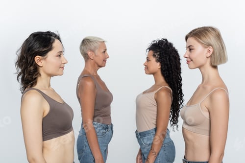 Preview: Side view of multiethnic women looking at each other isolated on grey