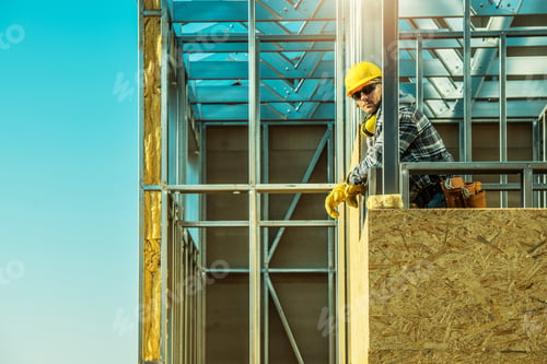 Preview: Construction Worker Proudly Standing at Building Site