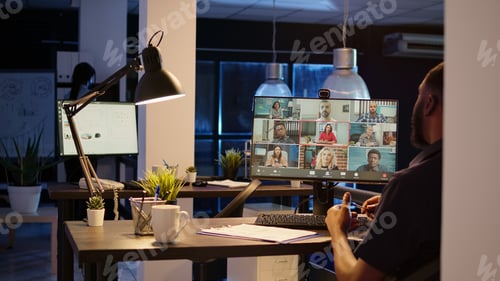 Preview: Male employee attending business meeting on teleconference