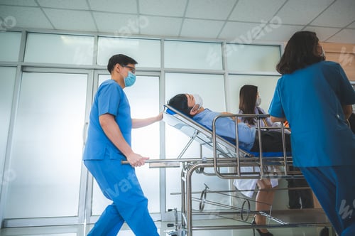 Preview: Emergency department, doctors and surgeons team move seriously injured patient lying