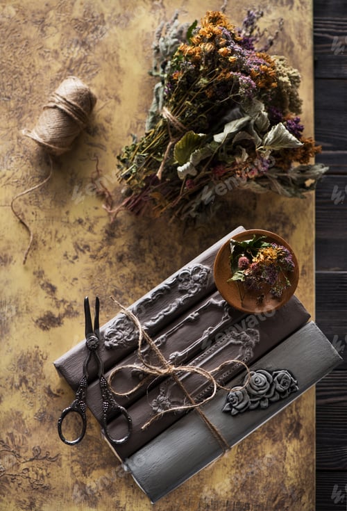 Preview: books and dried herbs background