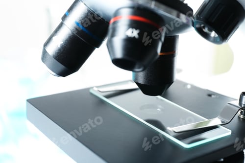 Preview: Modern microscope with different lenses, closeup. Chemical research