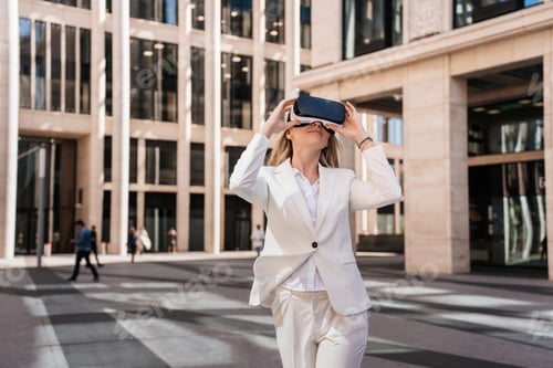 Preview: woman in suit using virtual reality glasses in the city. entrepreneur woman in vr headset