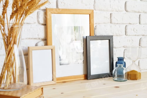 Preview: Photo frames on a brick wall background on the table with wheat ears in vase