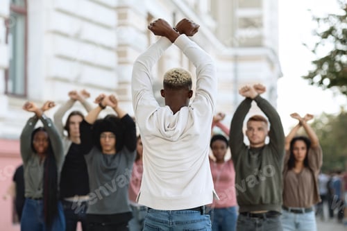 Preview: Unrecognizable african american guy leading group of protestors