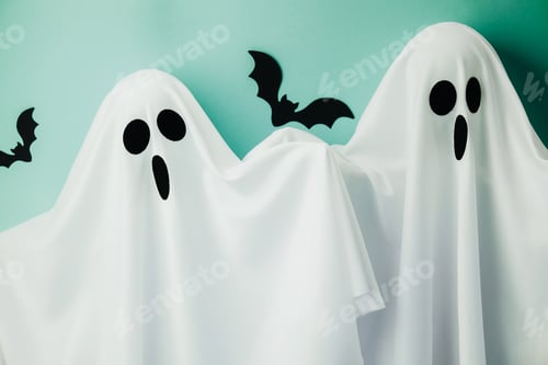 Preview: Two white ghost costumes with cutout faces and bats on turquoise background