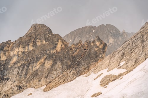 Preview: Idyllic landscape with snow on rocky mountain