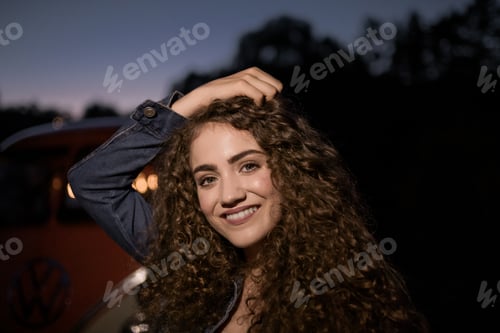 Preview: A young girl standing outdoors at night in the countryside.