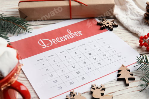 Preview: Paper calendar and festive decor on wooden table
