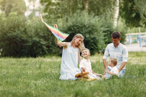 Preview: Cute family playing in a summer field