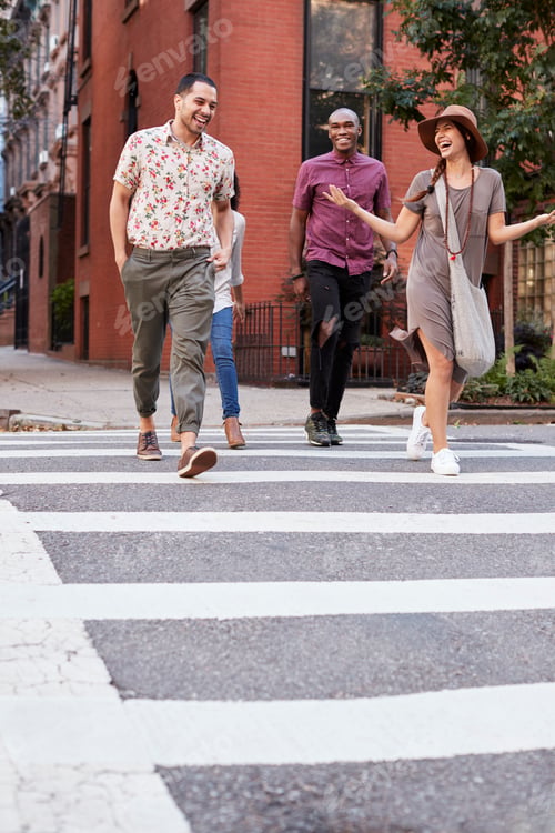Preview: Group Of Friends Crossing Urban Street In New York City