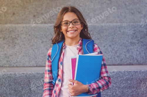 Preview: Portrait of happy caucasian young preteen girl elementary middle school