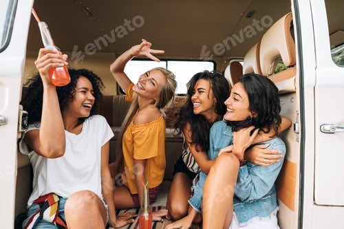 Preview: Group of young women having fun during a road trip