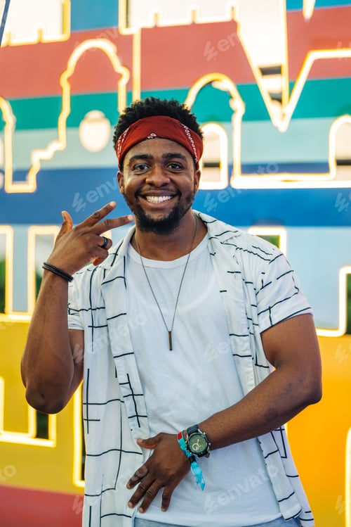 Preview: Young influencer posing and smiling with a colorful background