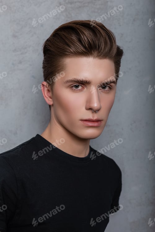 Preview: Portrait of cool hipster man in a black fashionable t-shirt in the studio. handsome guy