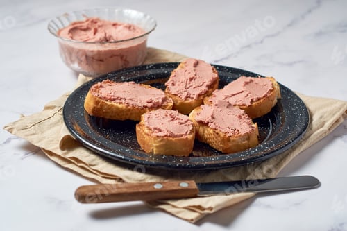 Preview: Bread toast with pork liver pâté on a rustic background.