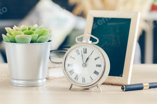 Preview: Morning sun. Alarm clock on a beautiful background