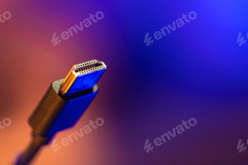 Preview: Macro hdmi connector on warm neon gradient. 4k signal.