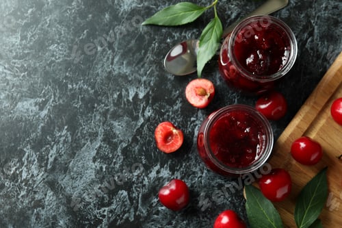 Preview: Cherry jam and ingredients on black smokey table