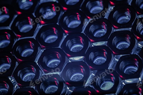 Preview: Overhead shot of screw nuts in a dark blue atmosphere with the lights coming under it
