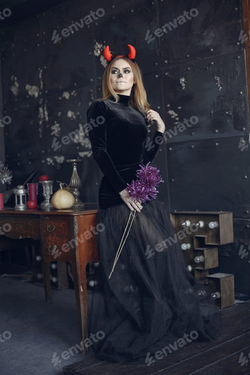 Preview: Portrait of smiling woman with Halloween skull make up