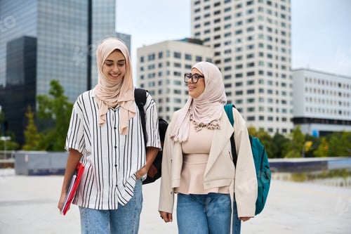 Preview: Muslim women students walking together on campus