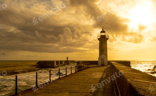 Preview: Lighthouse situated at the end of a long pier on the background of a dreamy cloudy sky