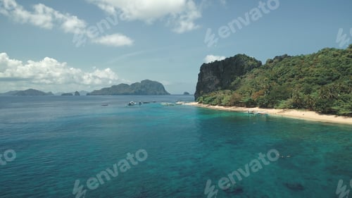 Preview: Aerial view of tropic paradise island, sand beach at sea bay coast. Greenery trees, plants