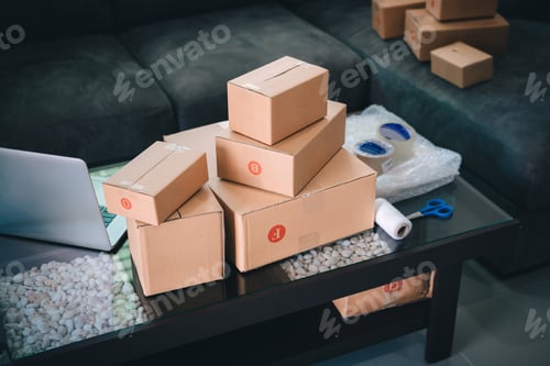 Preview: Parcel boxes and equipment for packaging placed on the table.