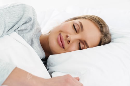 Preview: Image closeup of cute young woman lying and sleeping in bed