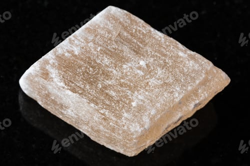 Preview: sample of raw selenite mineral on black granite