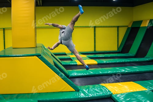 Preview: trampoline jumper performs acrobatic exercises on the trampoline