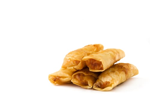 Preview: Crispy fried spring rolls stacked on white background