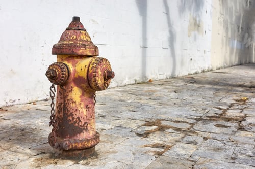 Preview: An old rusty fire hydrant on a street of Guayaquil, selective focus, Ecuador.
