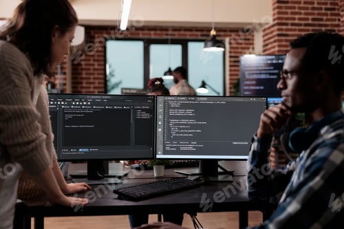 Preview: Multiethnic cyber security team members in agency office writing cloud database processing algorithm