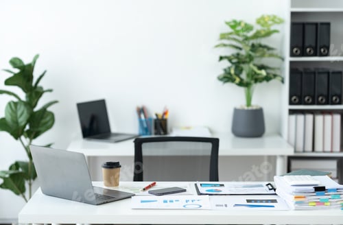 Preview: Workspace image. There are laptops, calculators, graphs, documents, folders, folders, stationery, mo