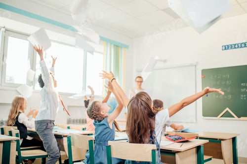Preview: school kids have fun in class and throwing paper in air