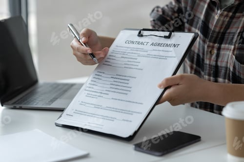 Preview: Businesswoman, office worker working using laptop and mobile phone in real estate accounting analysi
